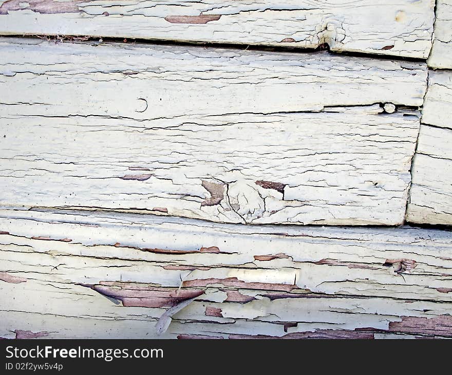 Closeup of old and worn white wooden wall.