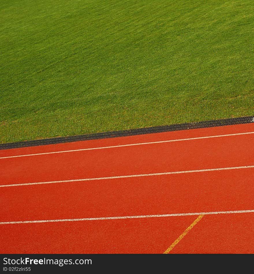 Racing track detail with grass in background