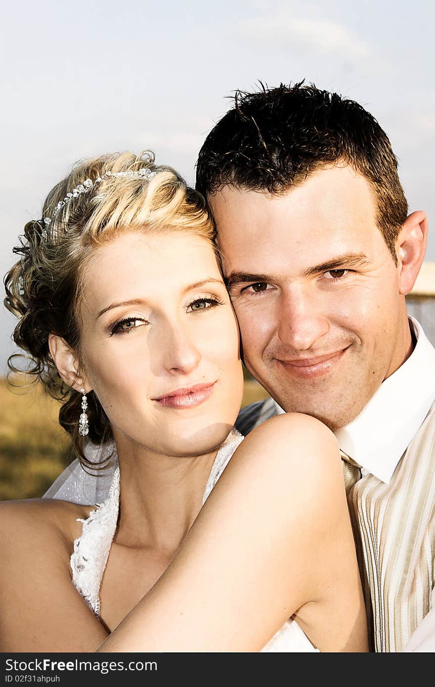 Beautiful bridal couple outdoors on their wedding day