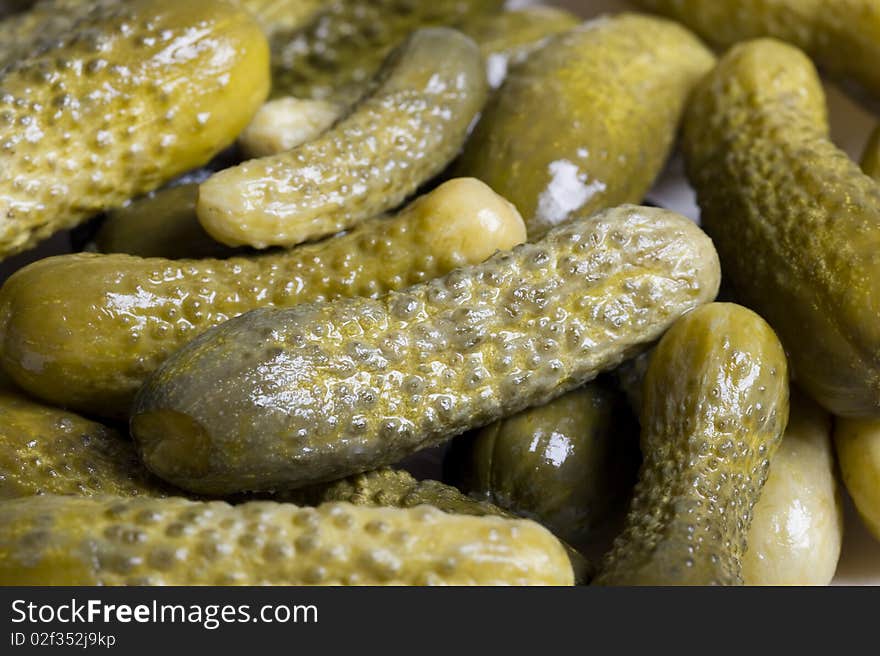 Green marinated cucumber  isolated on white background