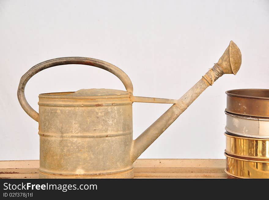 An old metal watering can