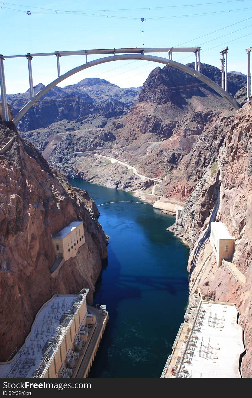 Hoover Dam and the Colorado river with under construction bridge.