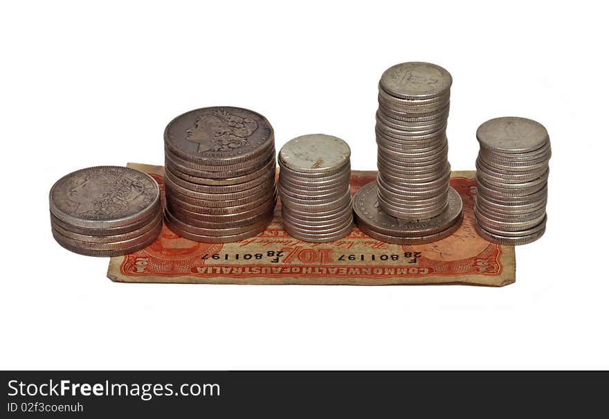 Assorted silver dollars and quarters, isolated on white background. Assorted silver dollars and quarters, isolated on white background