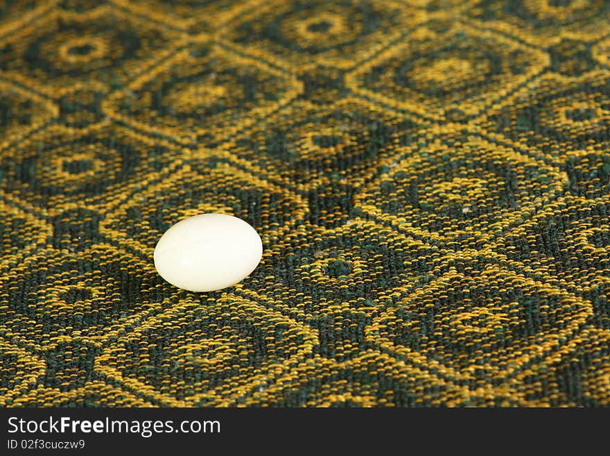 Tablecloth and pill