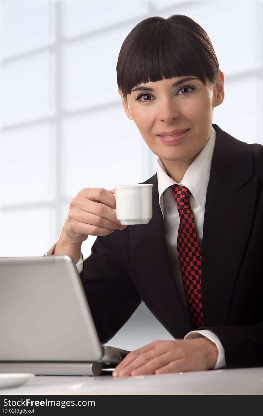 The business woman on a break with the laptop