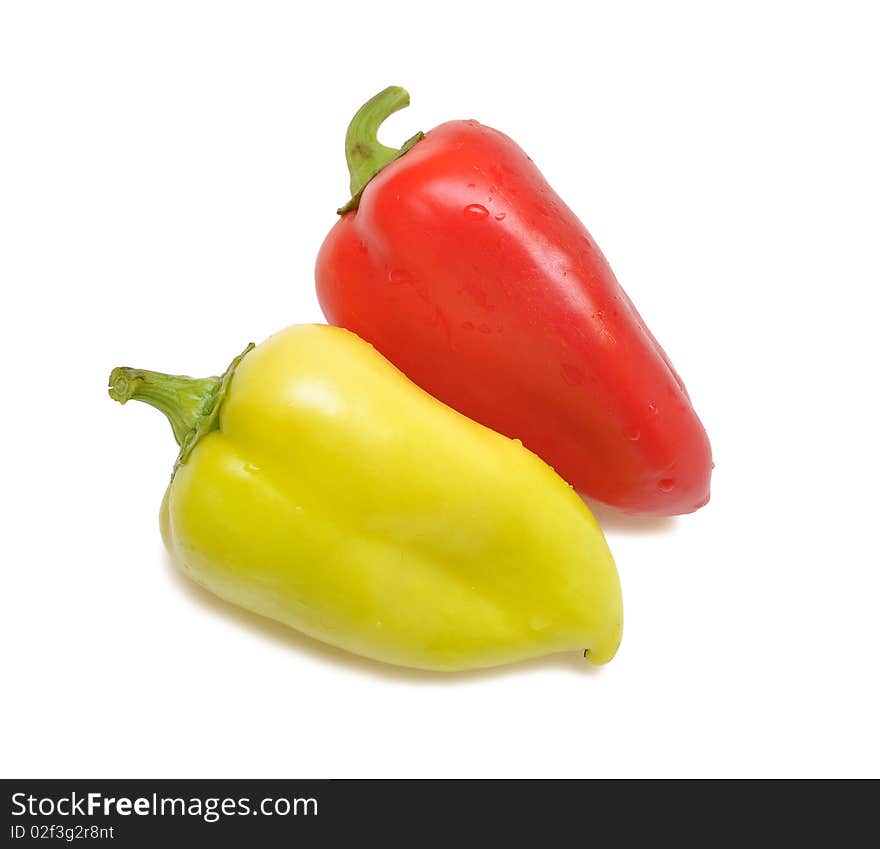 Red and yellow sweet paprika on white background