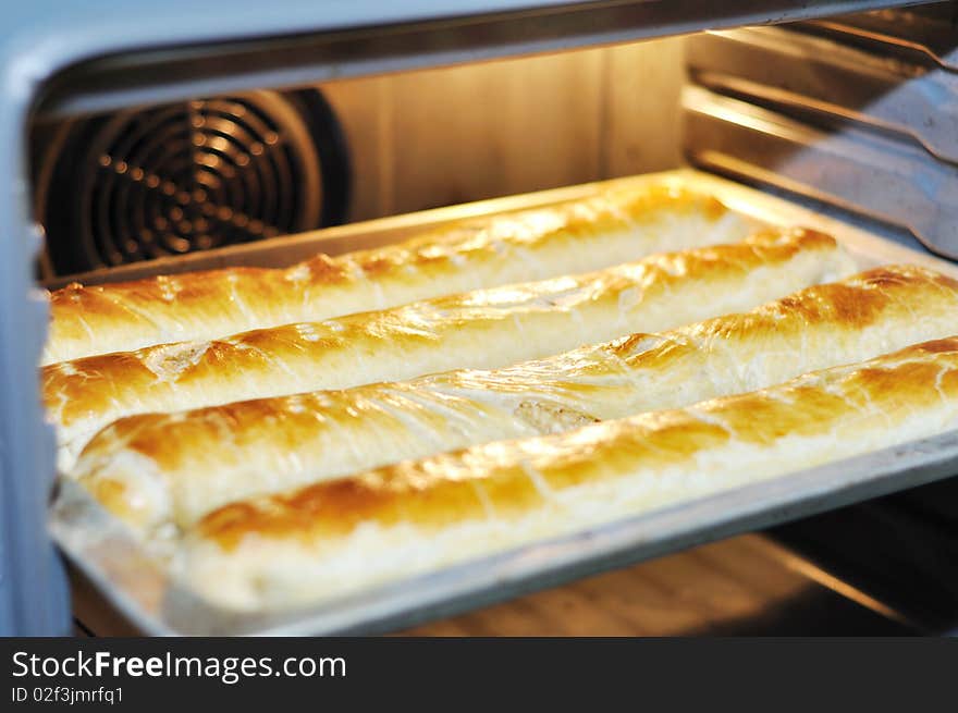 Baking apple pie in shape of socks in an electric oven