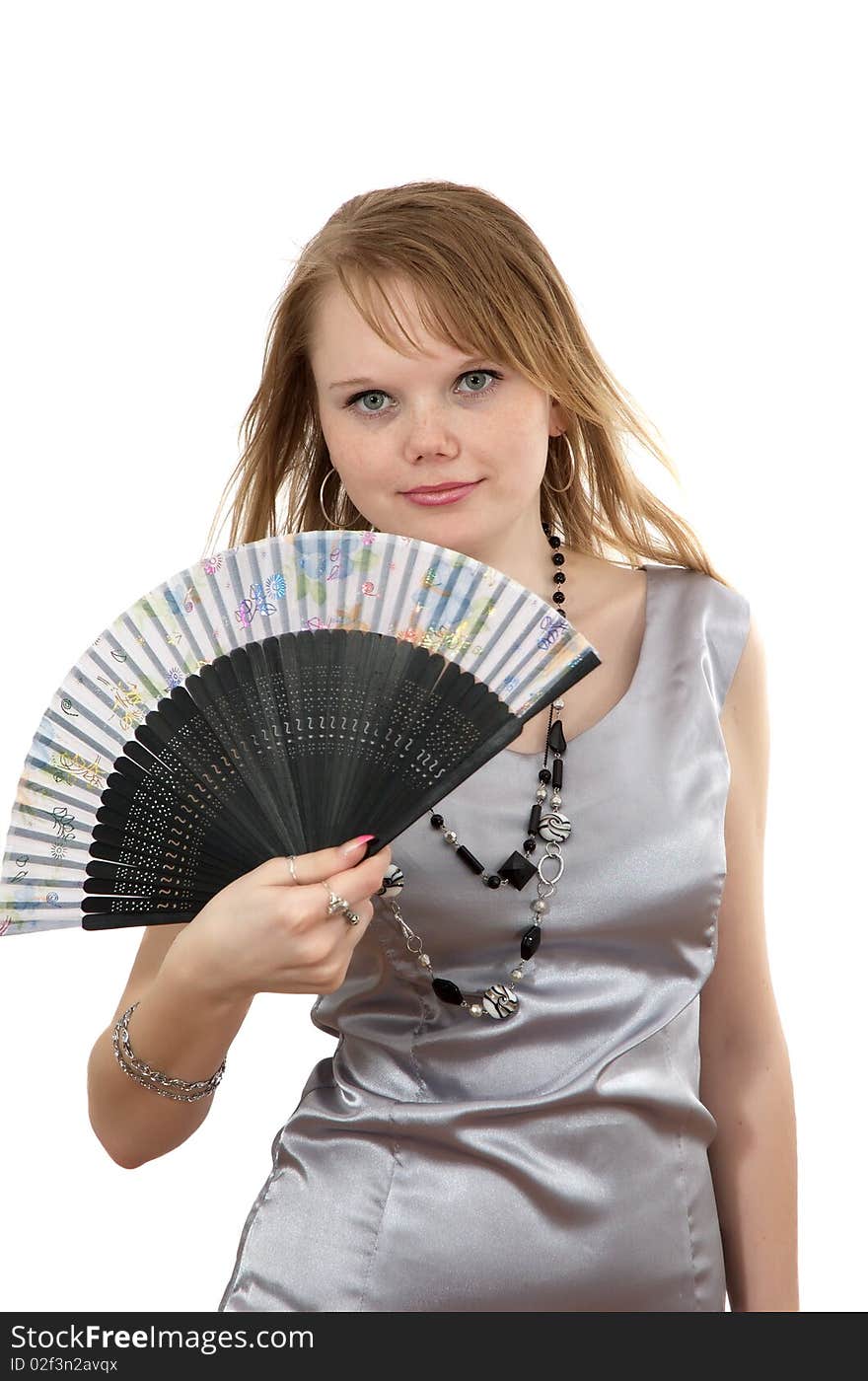 Making look younger girl smiles and keeps in hand fan on white background. Making look younger girl smiles and keeps in hand fan on white background