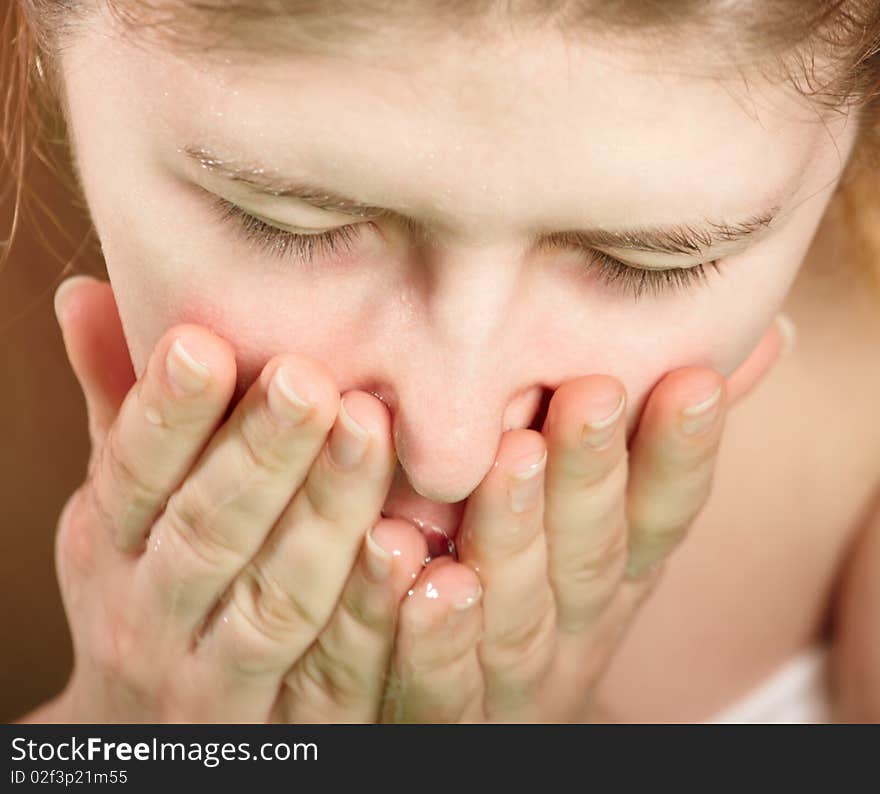 The young girl washing face