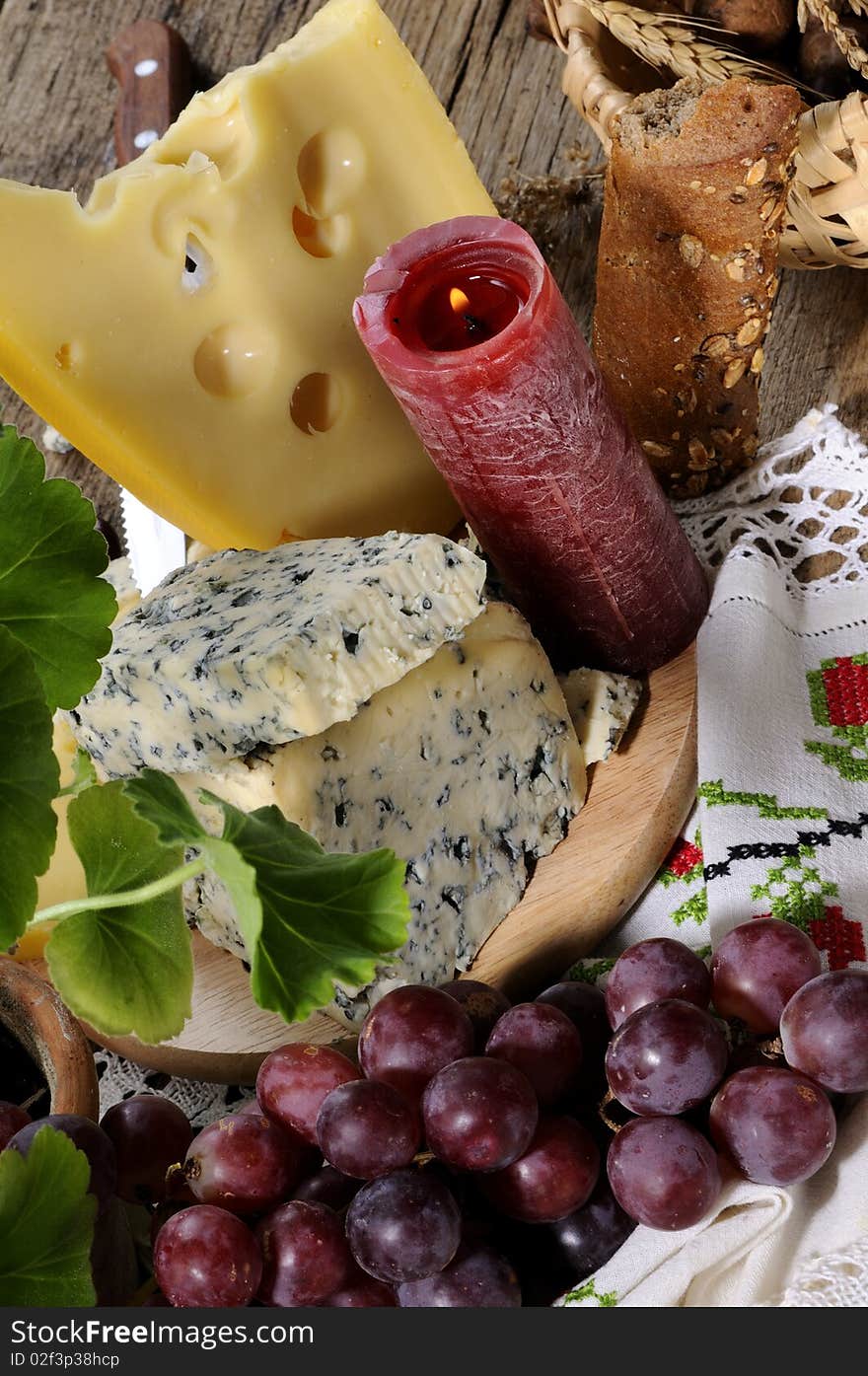 Closeup with blue cheese, fruits studio isolated, traditional towel in background. Closeup with blue cheese, fruits studio isolated, traditional towel in background