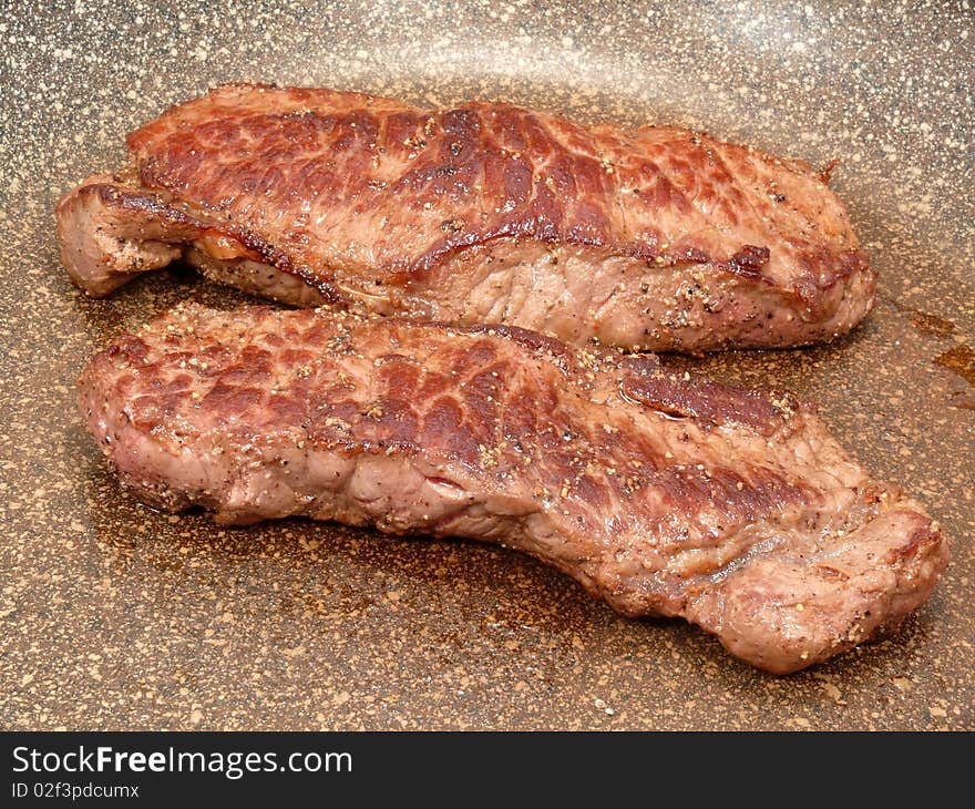 Freshly fried beef steaks, brown and good