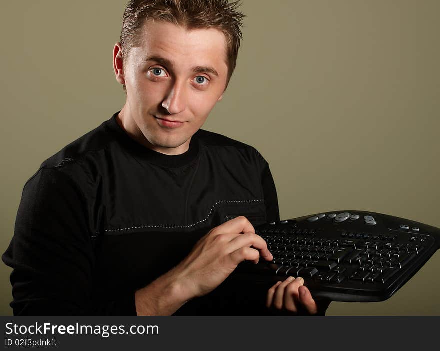 Happy young man with keyboard