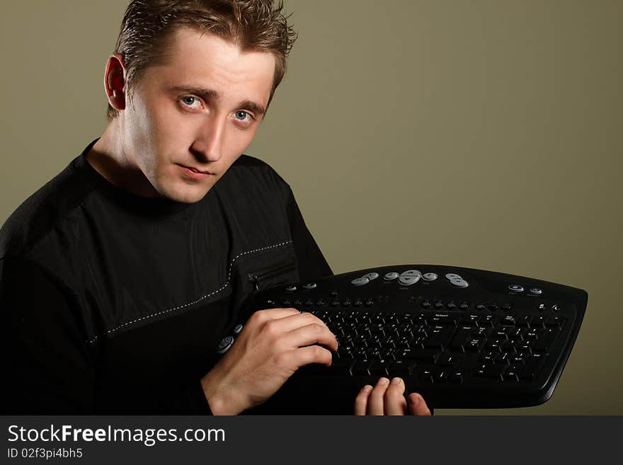 Happy young man with keyboard