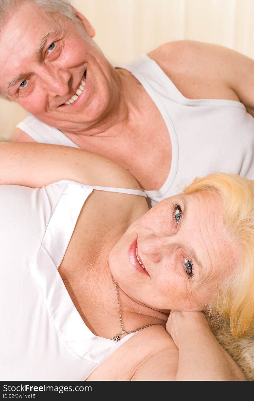 Happy elderly couple smiling together. Happy elderly couple smiling together