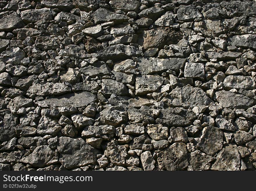 Old fortress wall made of solid stones. Old fortress wall made of solid stones