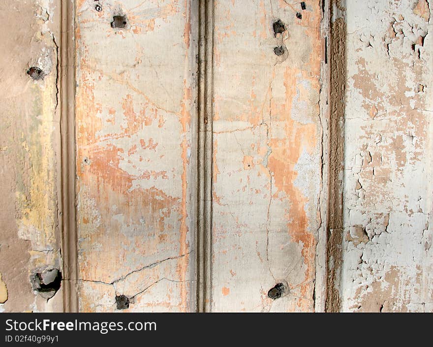 Grunge scratched texture / background on a cracked stone and wooden wall. Grunge scratched texture / background on a cracked stone and wooden wall.