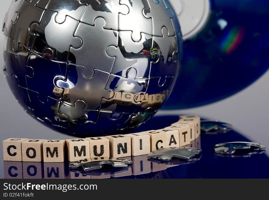 Globe puzzle with CD on blue background