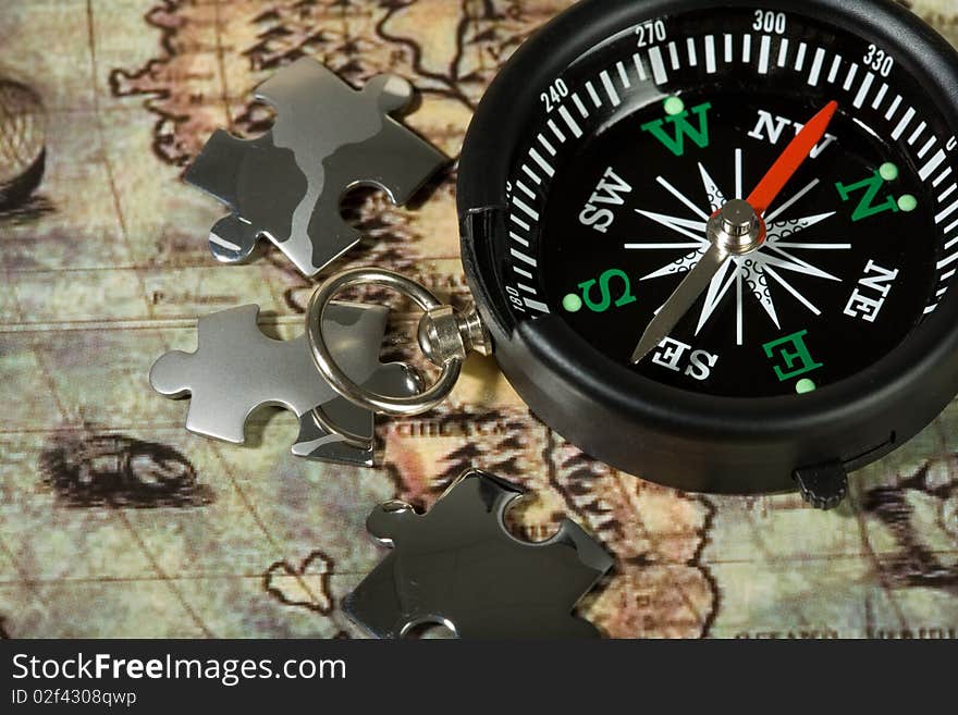 Compass on the old map. Concept travel.