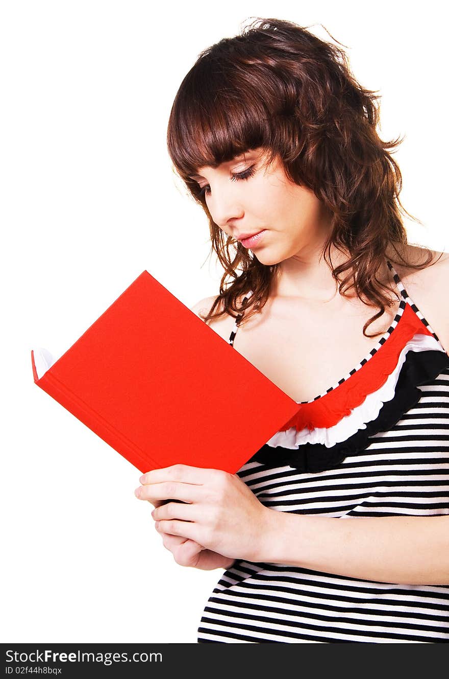 Lovely brunette reading a red book on white