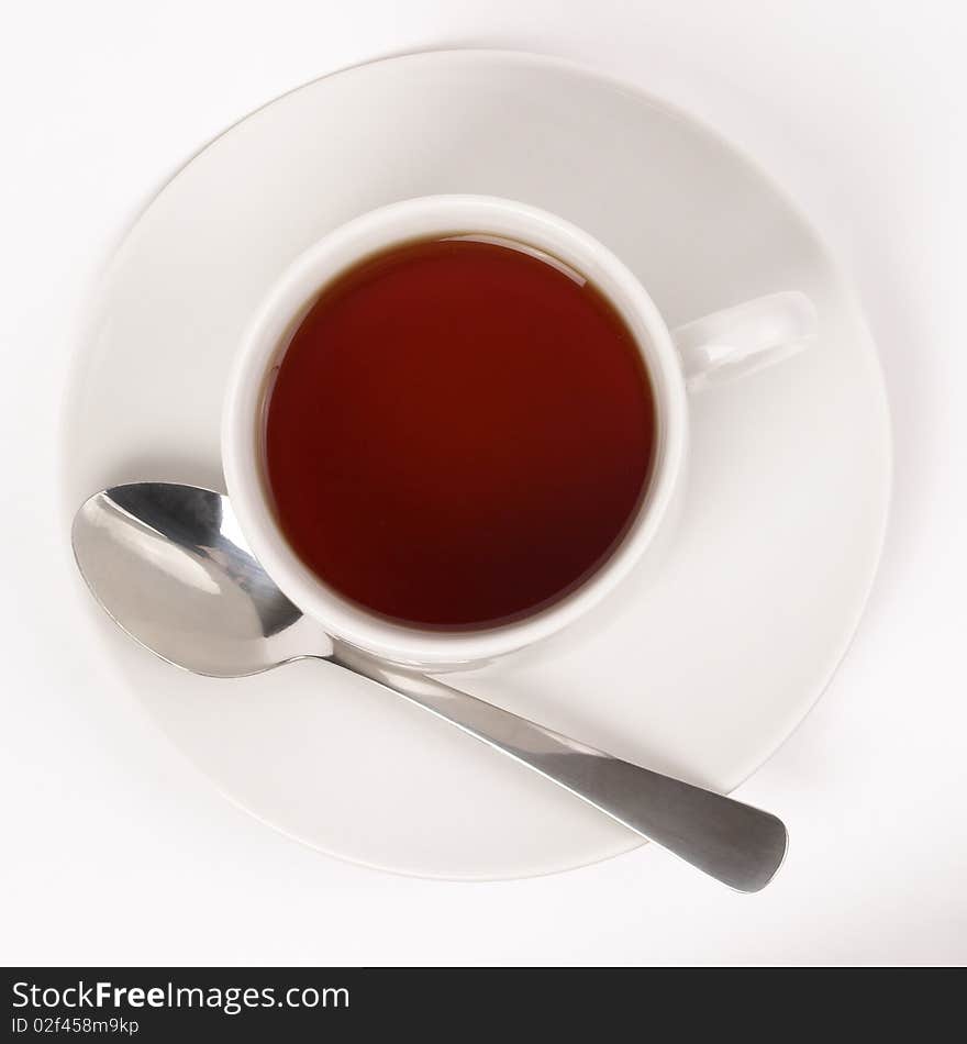 Little white tea cup isolated over grey gradient background