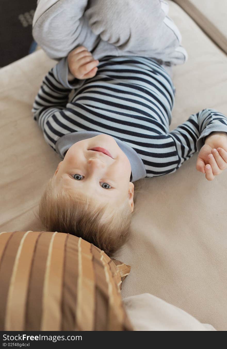 Boy laying on his back and smiling. Boy laying on his back and smiling