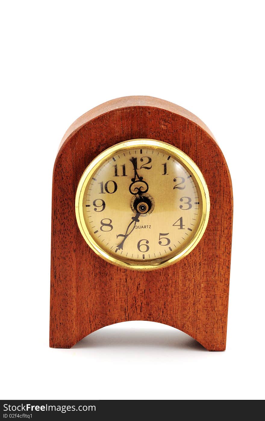 Table clock in a frame of wood photographed in front of white background. Table clock in a frame of wood photographed in front of white background