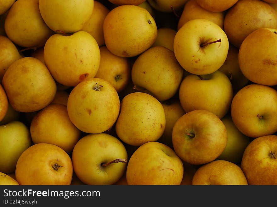 Fresh yellow apples at the market