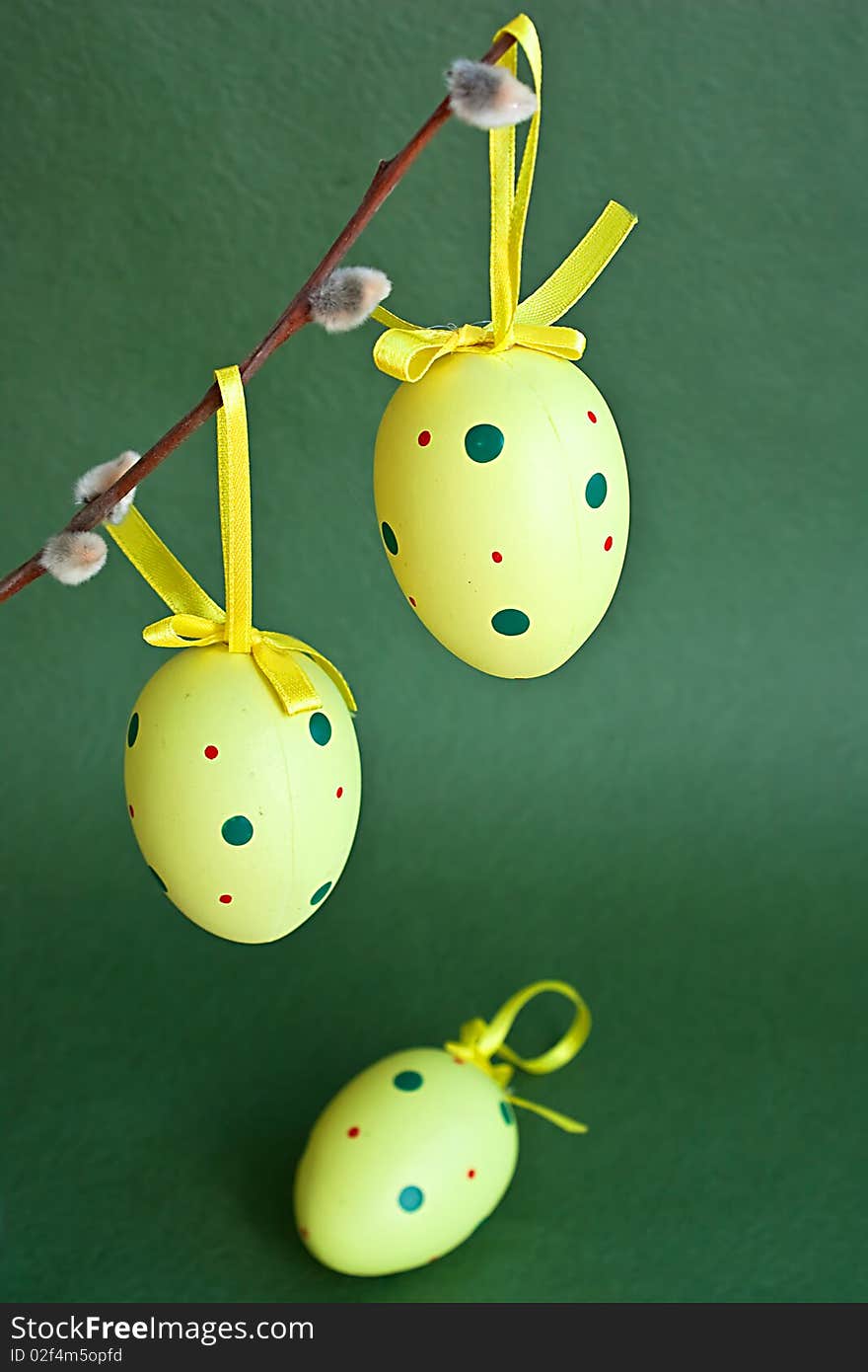 Yellow Easter eggs on green background