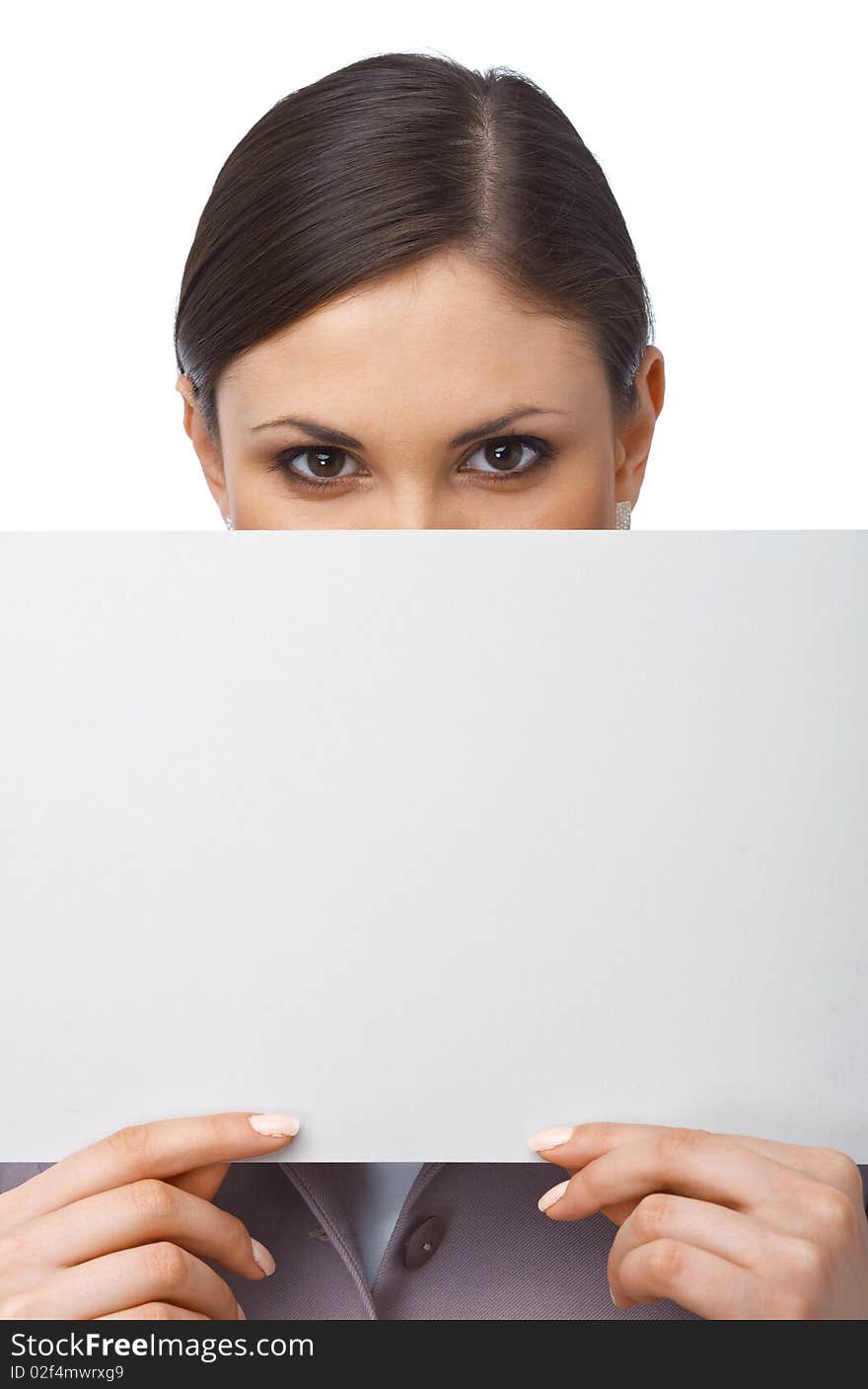 Closeup portrait of a young girl hiding behind an empty white billboard , isolated on white. Closeup portrait of a young girl hiding behind an empty white billboard , isolated on white