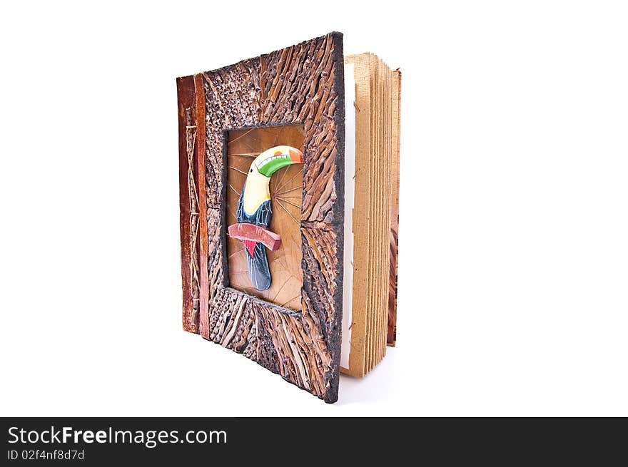 Wooden photo album with parrot isolated on white