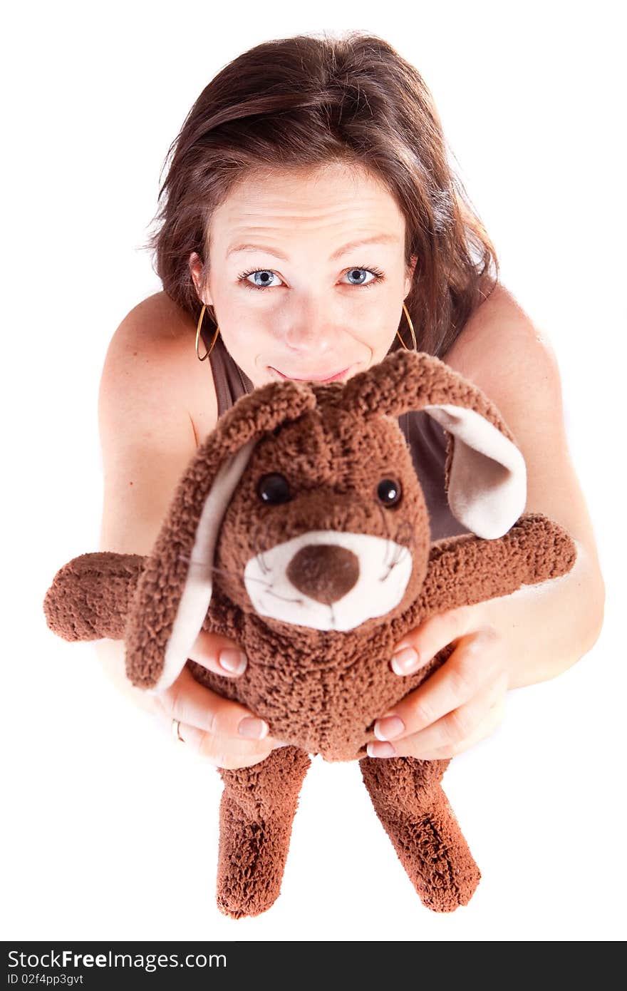 Young beautiful woman holding up a bunny towards the camera. Young beautiful woman holding up a bunny towards the camera.