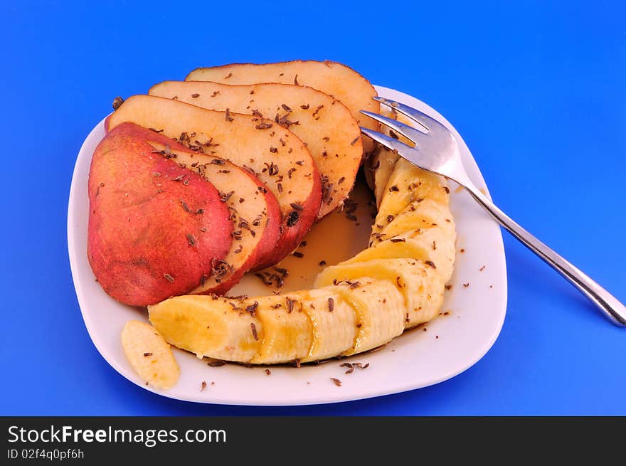 Pear and banana against a blue background