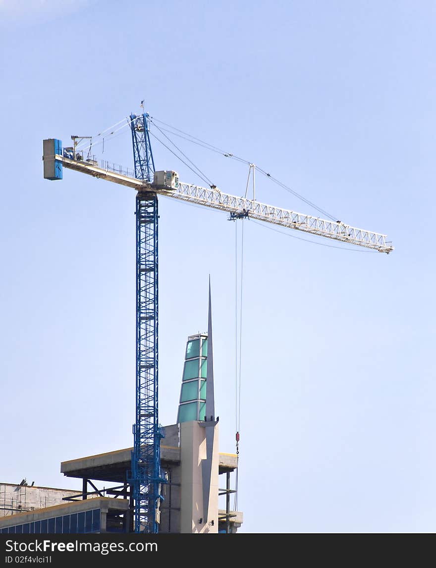 Crane Towering Over Building