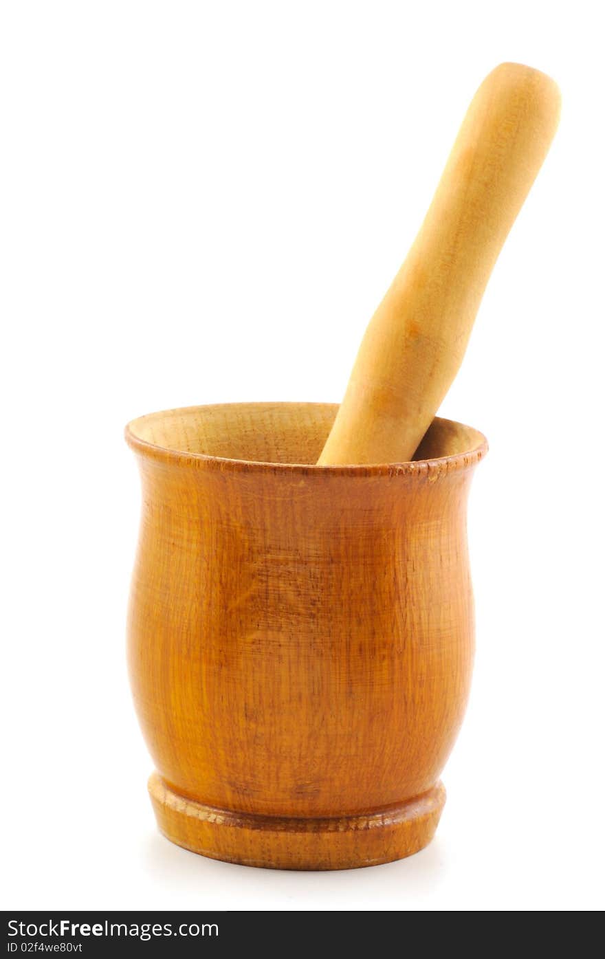 Wooden mortar and pestle photographed in front of white background