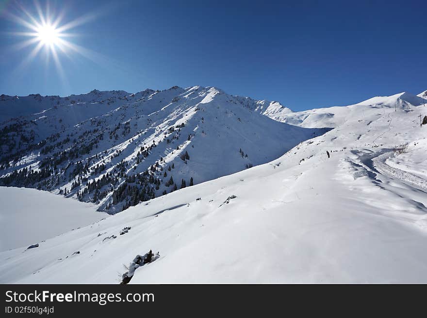 The winter sun over mountains