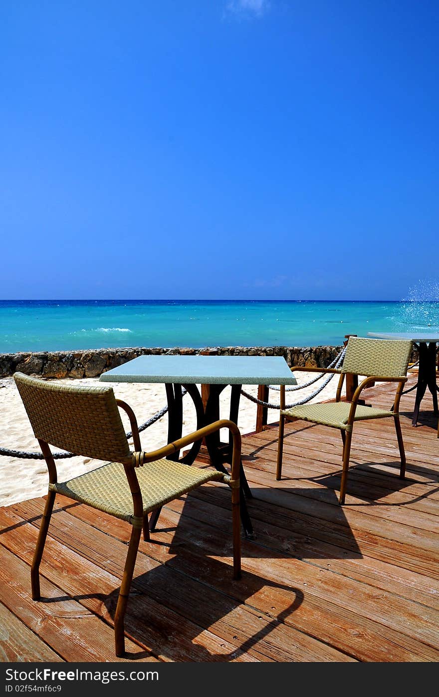 Table and char of the restaurant on the beach. Table and char of the restaurant on the beach