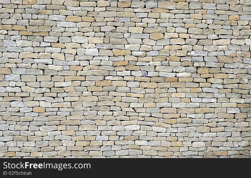 Closeup of ancient stonewall for background