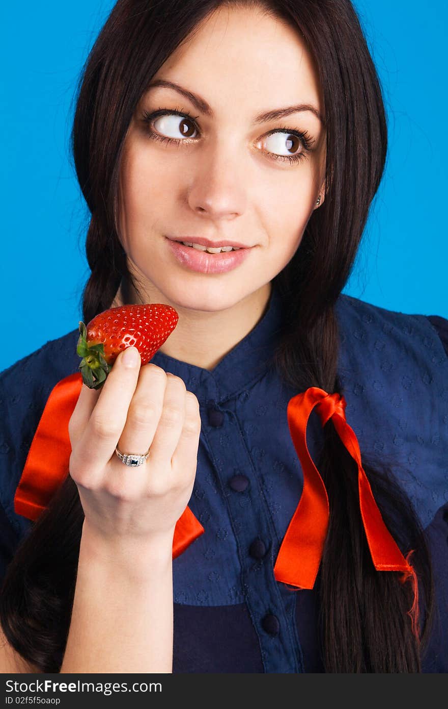 Beautiful lady holding a strawberry