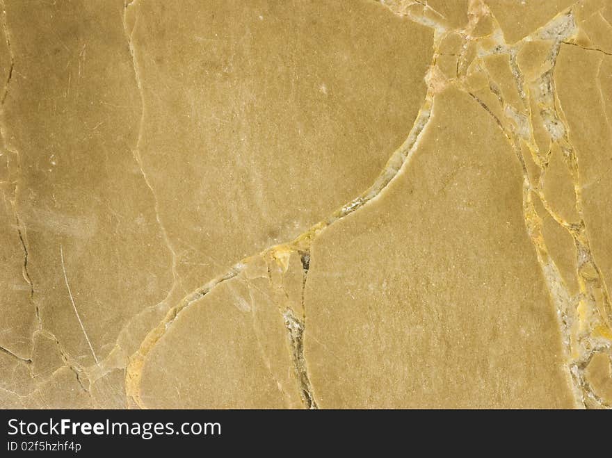 Closeup of beige stone with natural patterns