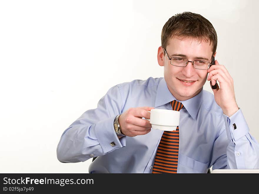 Handsome young businessman with coffee cup