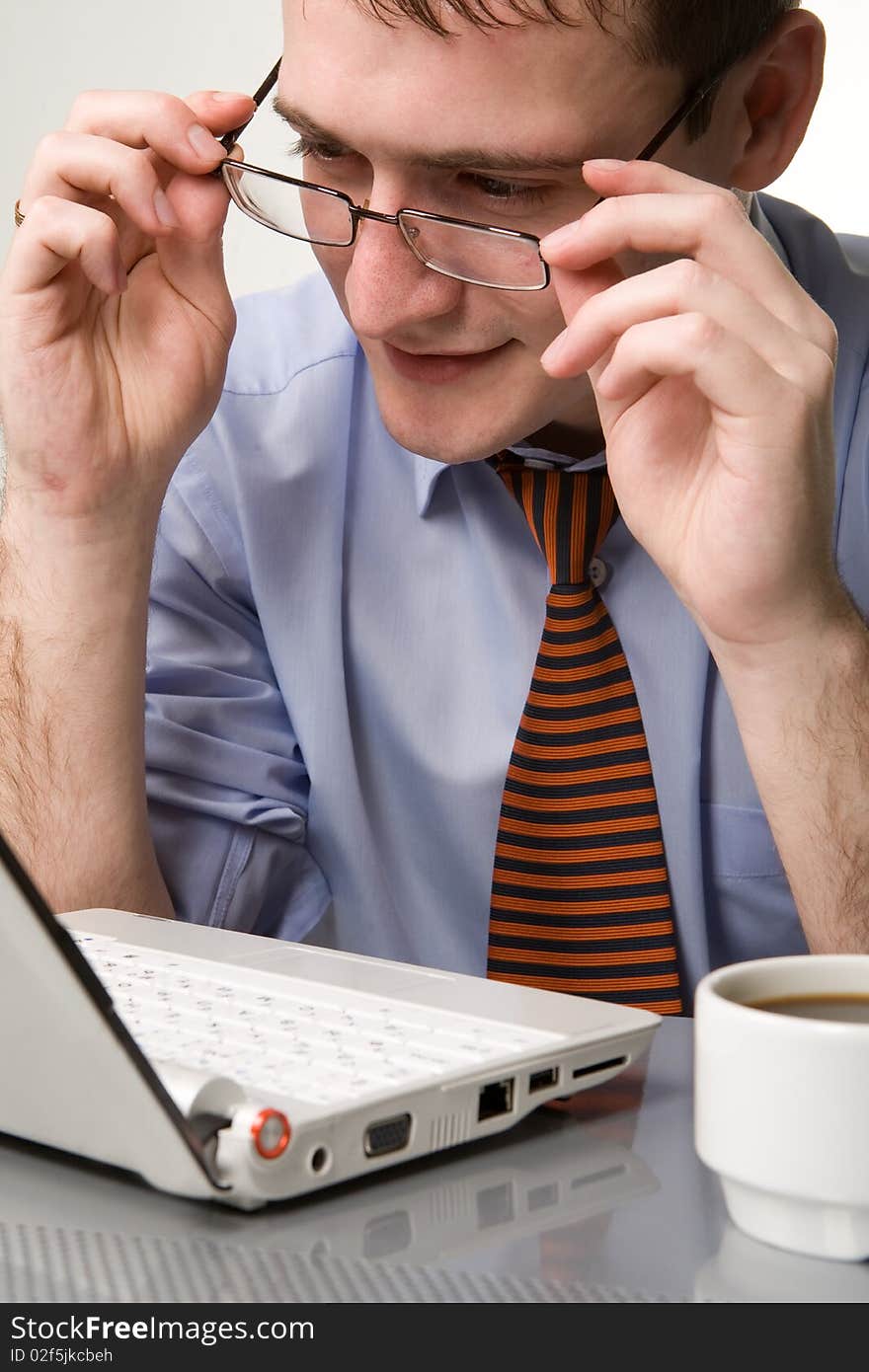 Young smiling businessman with cup of coffee. Young smiling businessman with cup of coffee