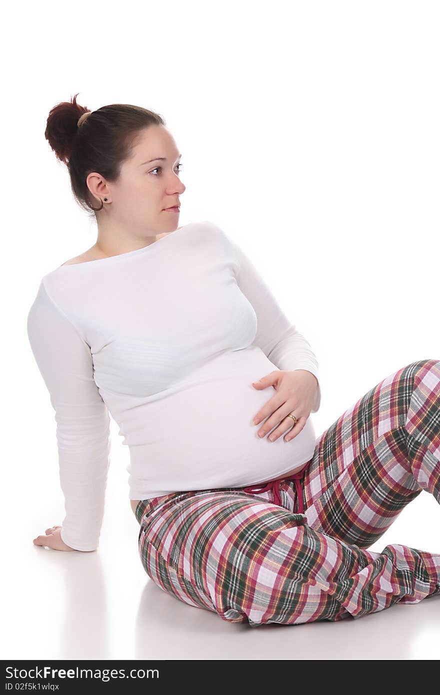 Pregnant woman holding belly on white background