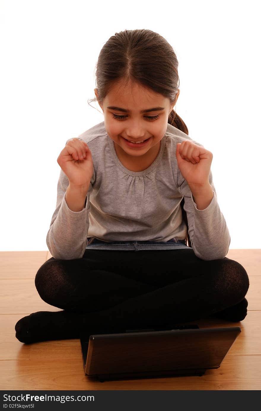 Young child looking happy using laptop. Young child looking happy using laptop