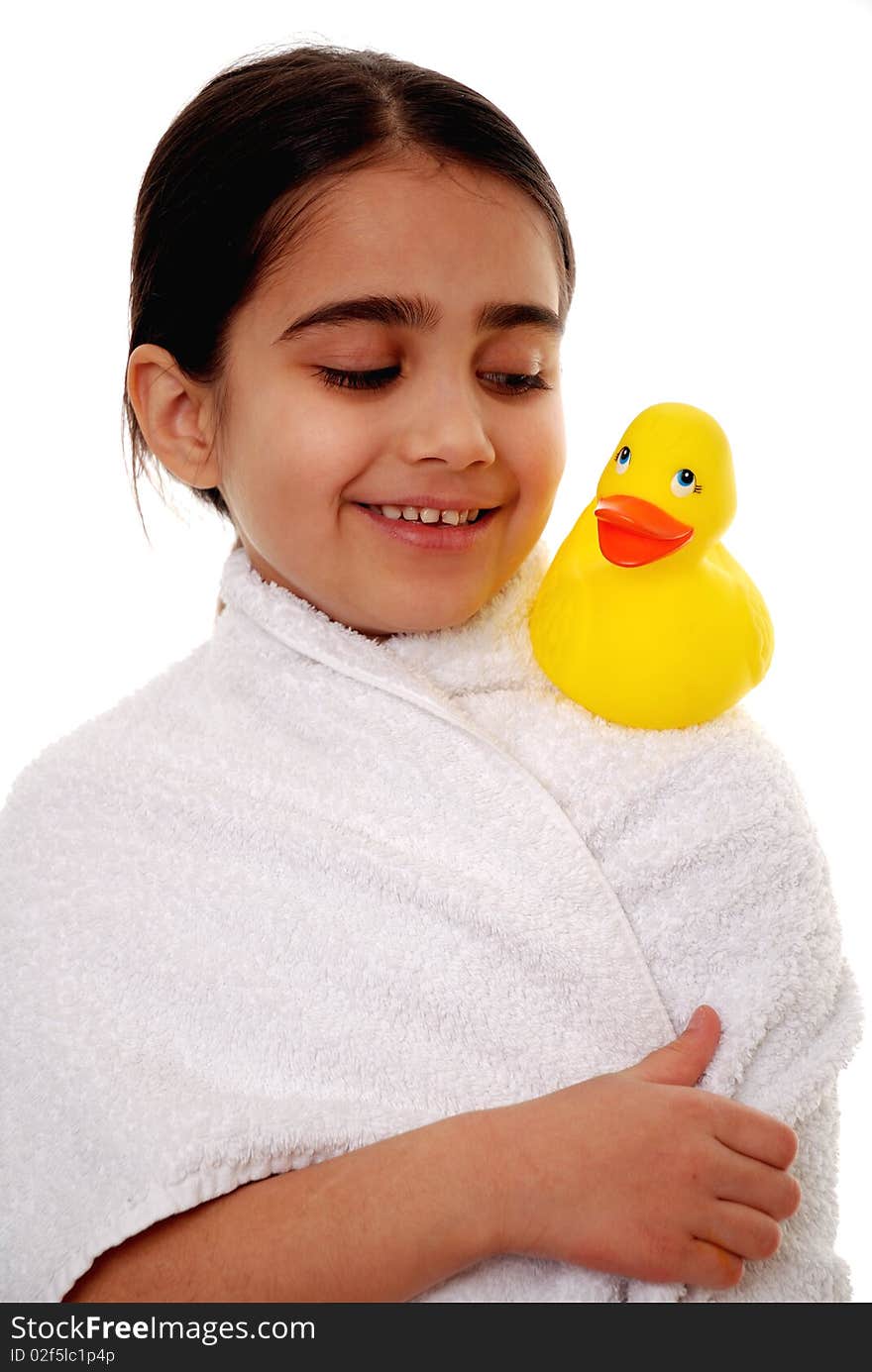 Cute young child looking at rubber duck isolated on white. Cute young child looking at rubber duck isolated on white