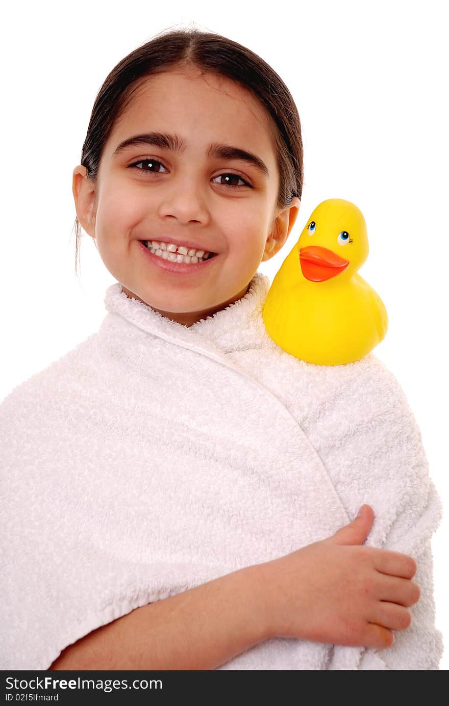 Smiling girl with rubber duck isolated on white. Smiling girl with rubber duck isolated on white