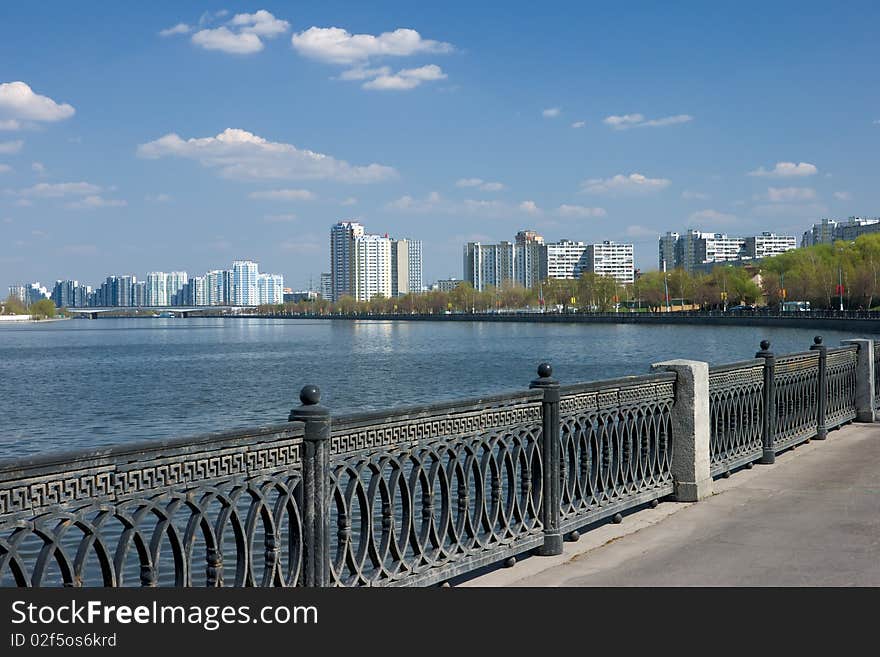 Quay of moscow river with homes on horizon. Quay of moscow river with homes on horizon