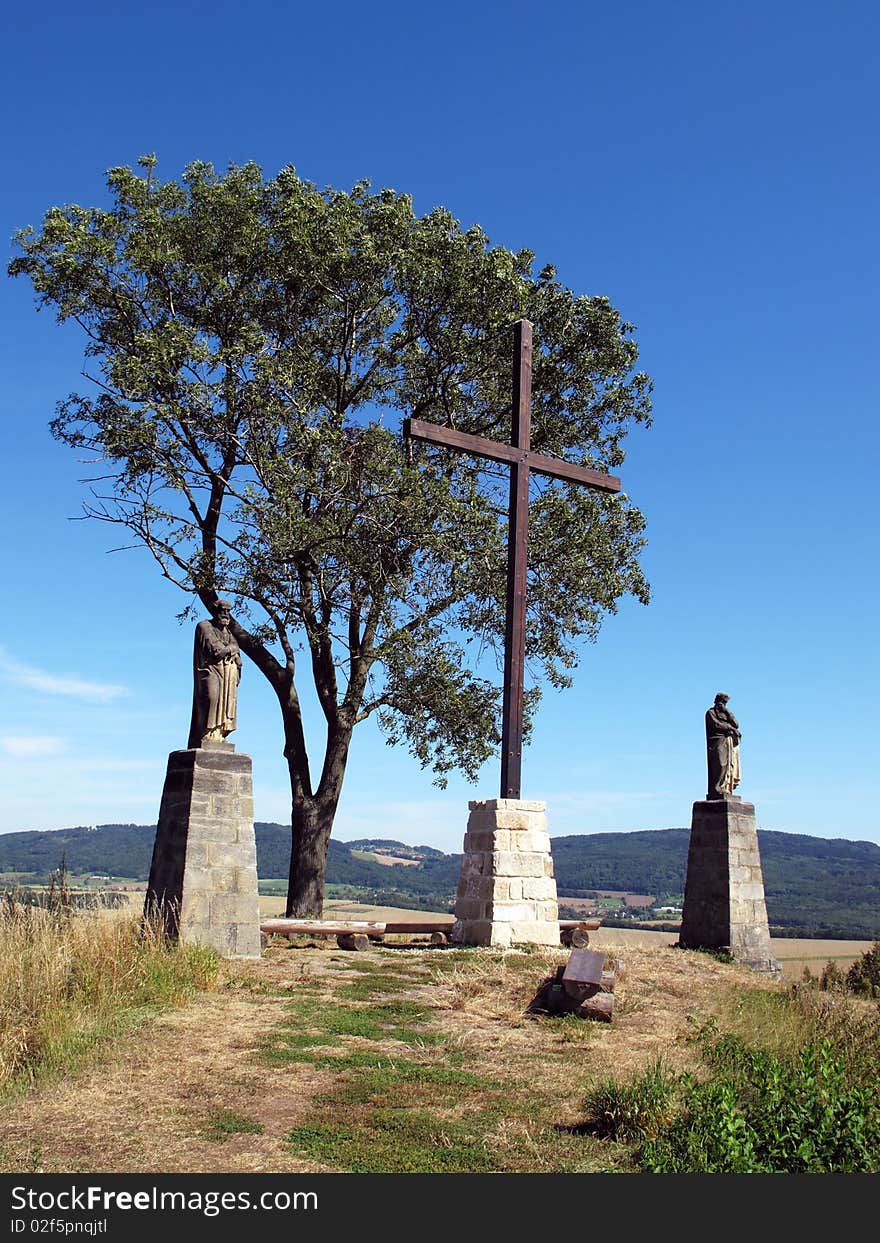 Cross on the hill with statues of Saint Peter and Saint Paul, Bohemian Paradise, Czech Republic, Europe.