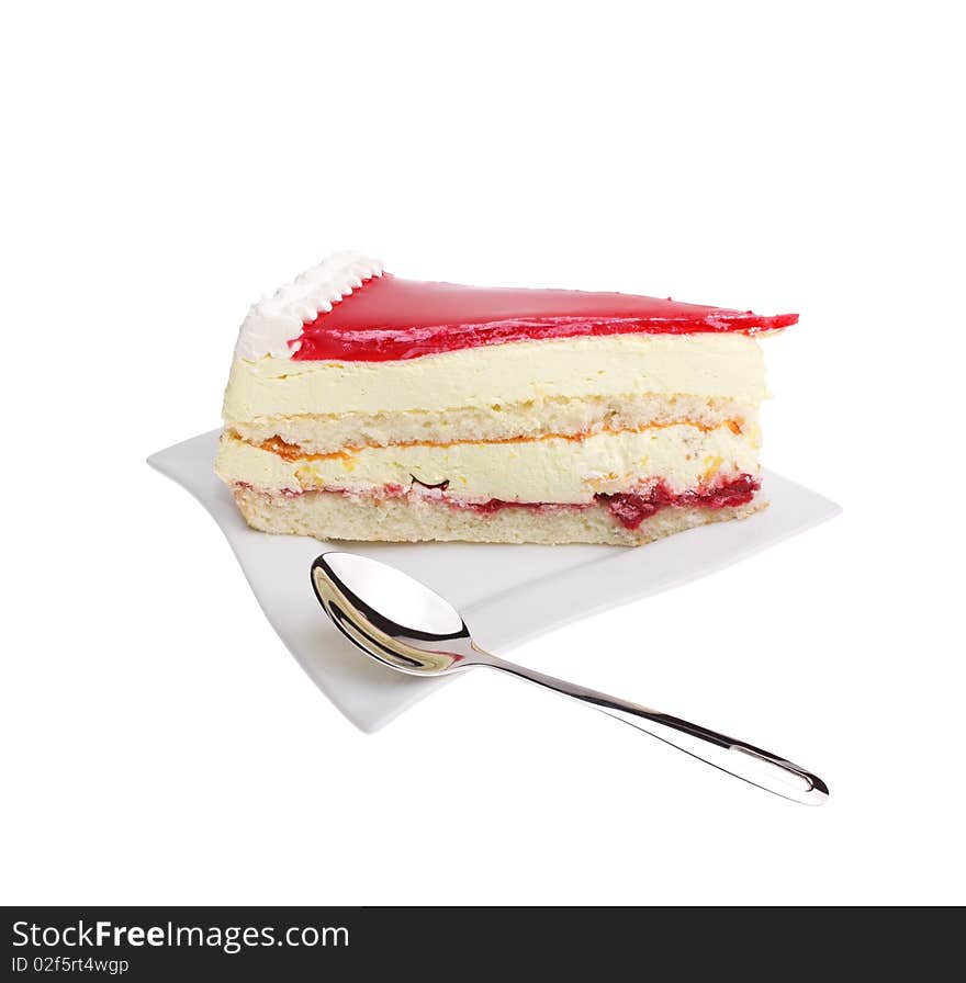 Dessert - cake with red fruit jelly on white plate