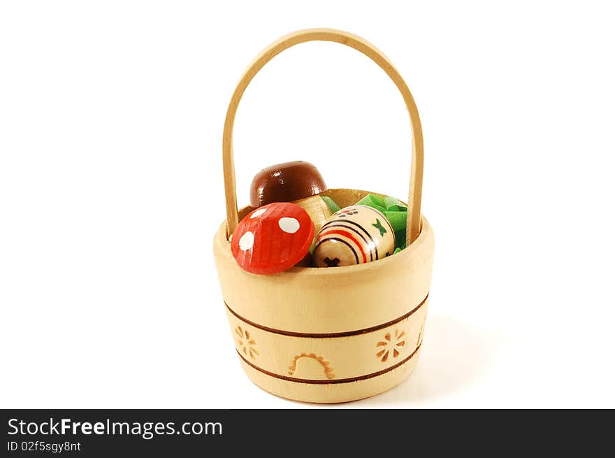 Decorative wood products in the form of baskets of mushrooms, isolated on a white background. Decorative wood products in the form of baskets of mushrooms, isolated on a white background