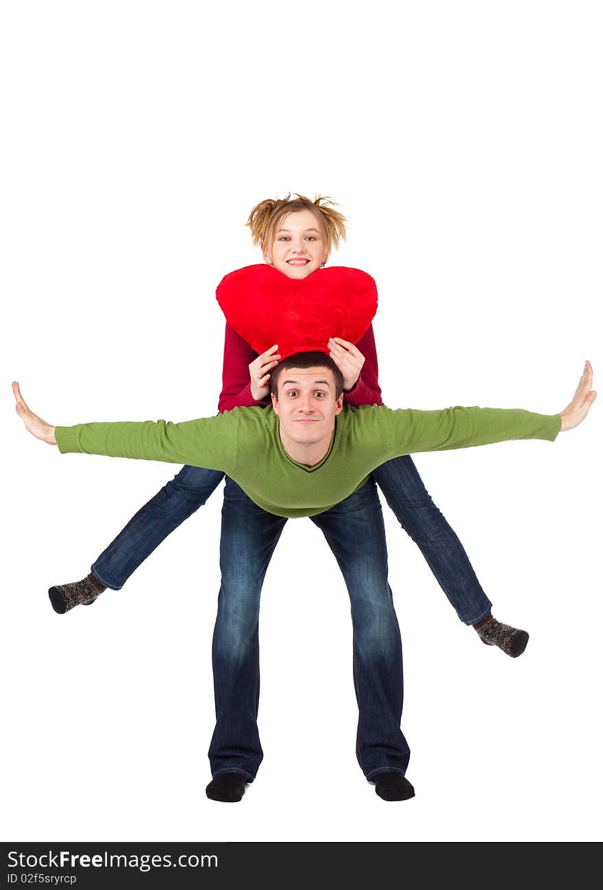 Young loving couple smiling with heart in hands looking at camera, beautiful woman on handsome man